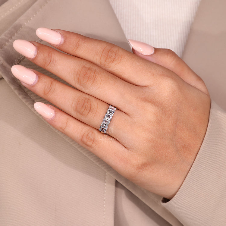 White gold band crafted as a half eternity ring.
