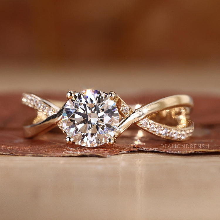 Twisted pave engagement ring with intricate detailing.
