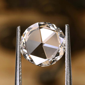 This 1.57 carat diamond features a beautiful round rose cut design.
