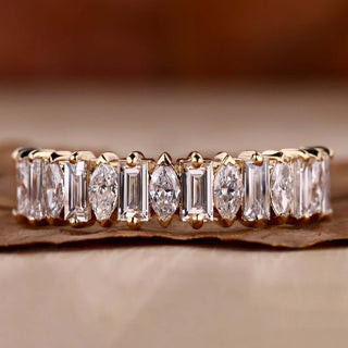 Baguette and marquise diamond band in a half eternity design with prong setting