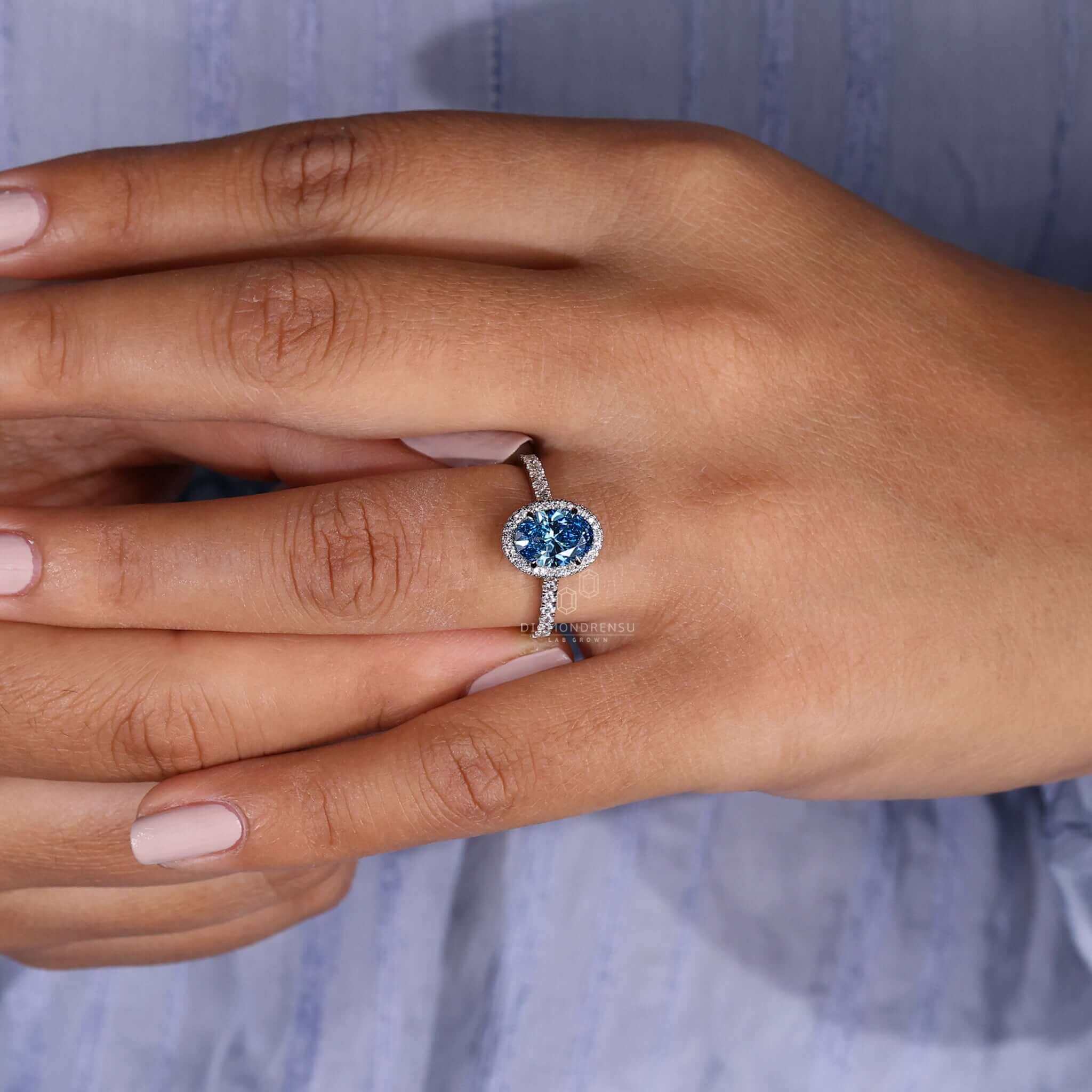 blue oval diamond engagement ring