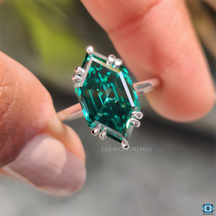 Green Marquise Moissanite ring with a round hidden halo design.
