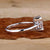 Elegant tapered baguette engagement ring set in a basket setting