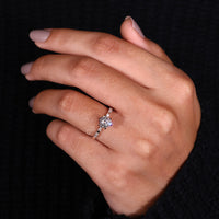 Round Cut Diamond Ring with elegant pave setting accents.