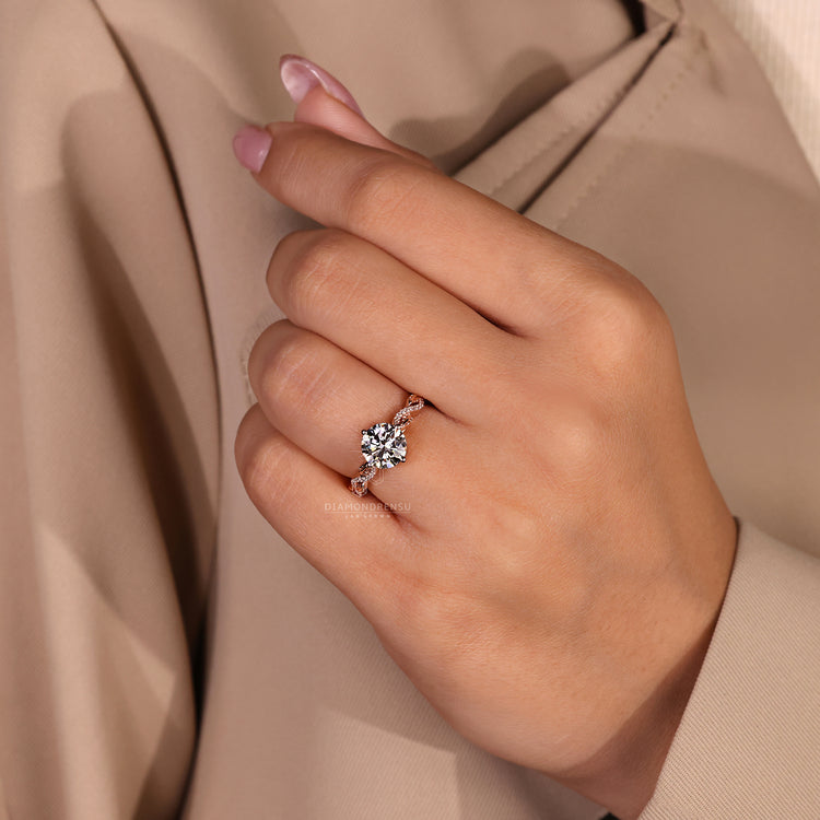 IGI certified round diamond ring in a rose gold finish.
