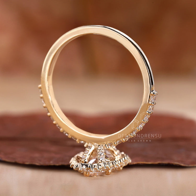 Yellow Gold Ring featuring a radiant pear diamond.