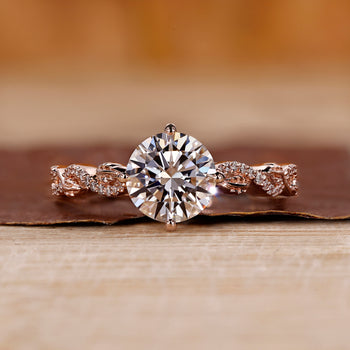 Round diamond engagement ring with a Compass Prong Setting design.
