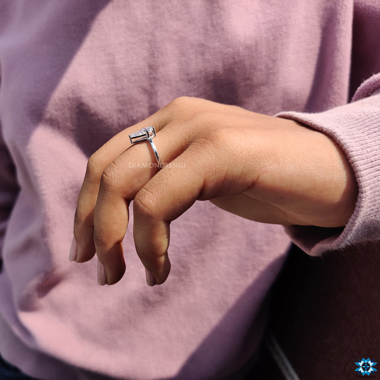 Diamondrensu engagement ring showcasing a handcrafted moissanite solitaire.
