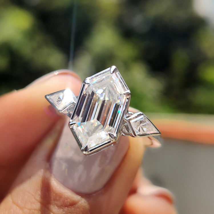 Three-stone bezel set ring in white gold