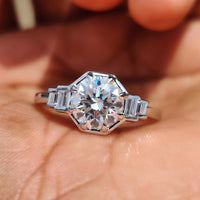 Round cut engagement ring with sparkling center moissanite.
