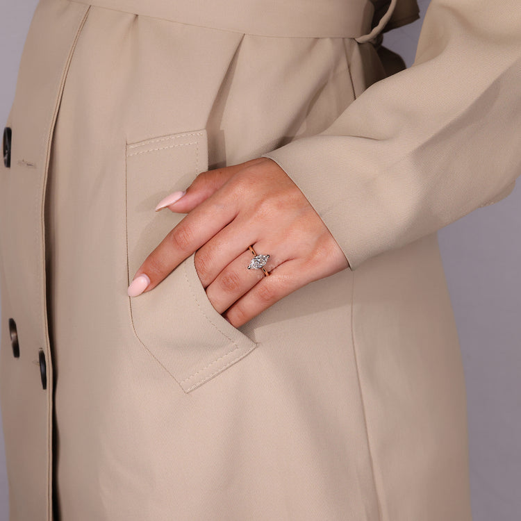 Custom Engagement Ring with a round diamond and V prong setting in yellow gold.
