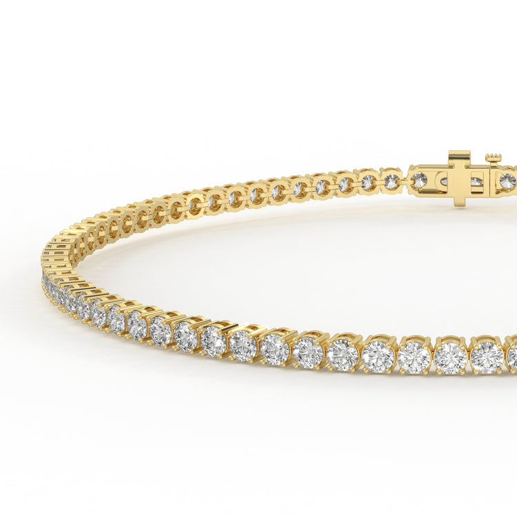 Yellow gold tennis bracelet with round diamonds.