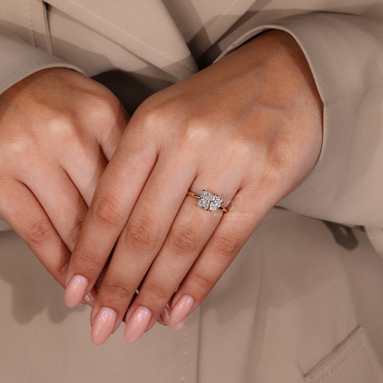 Pear cut diamond ring featuring a two-stone design in yellow gold.
