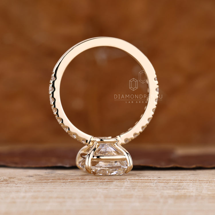 Diamondrensu ring designed as elongated cushion with round cut pave band ring.
