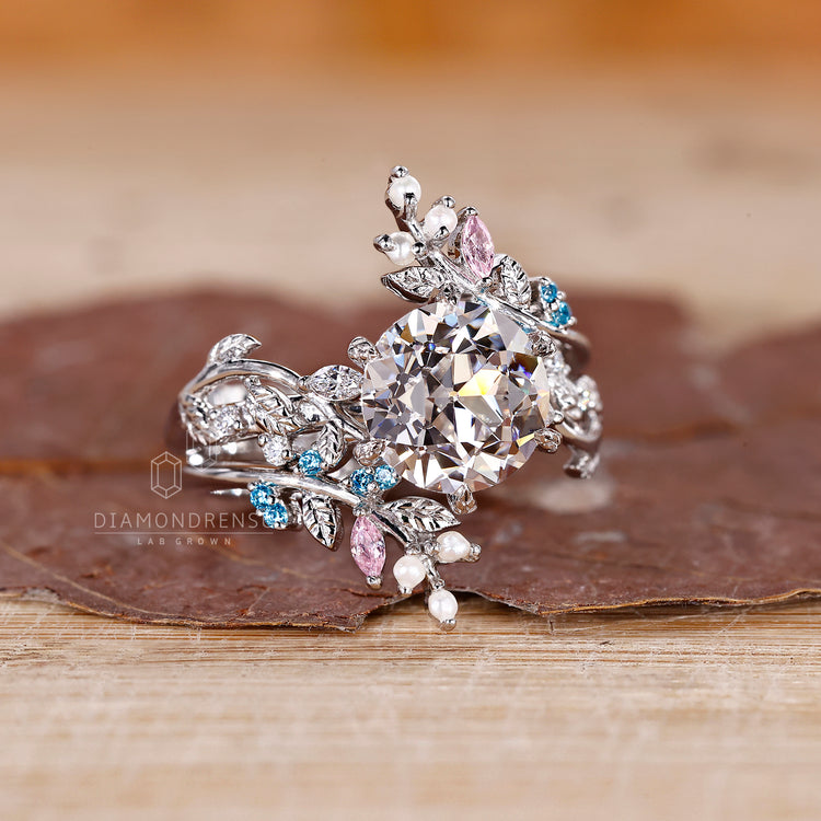 Pink marquise diamond band in a custom engagement ring.
