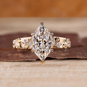 Dutch marquise engagement ring featuring a nature inspired marquise side diamond design.
