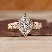 Dutch marquise engagement ring featuring a nature inspired marquise side diamond design.
