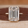 Bezel set emerald cut diamond ring.
