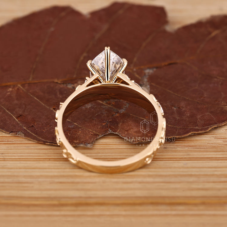 Handmade ring from Diamondrensu featuring a Dutch marquise centerpiece.
