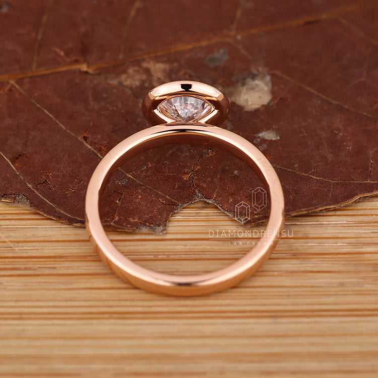 Handmade jewelry ring with round diamond halo and 4 prong claw setting.
