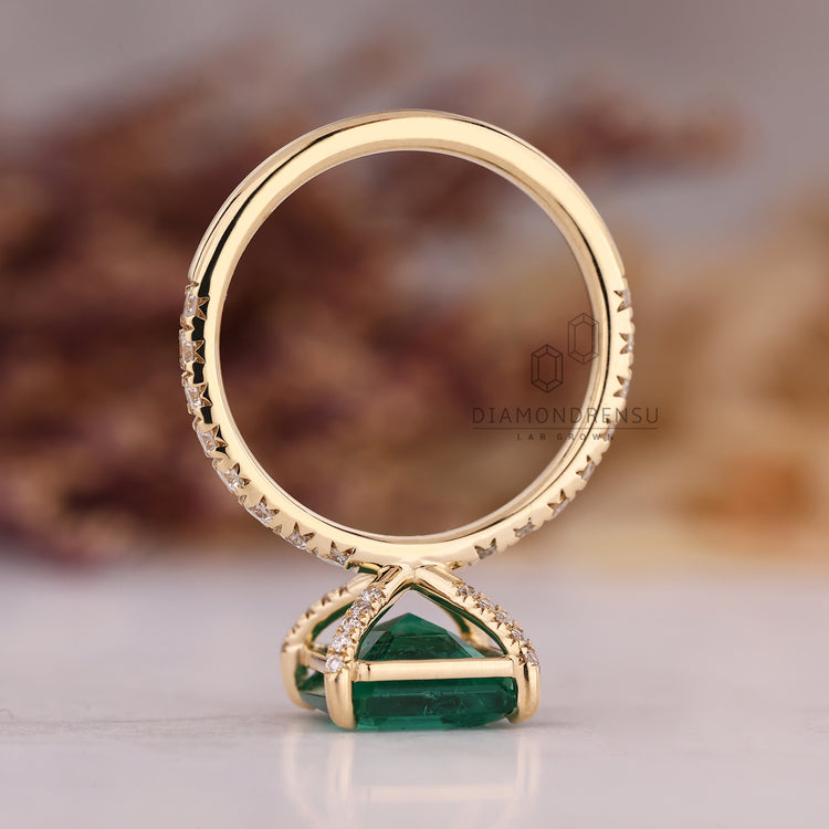 Handmade asscher cut emerald engagement ring.
