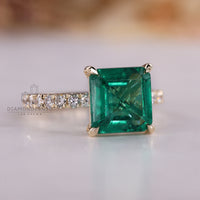 Pave setting emerald engagement ring.
