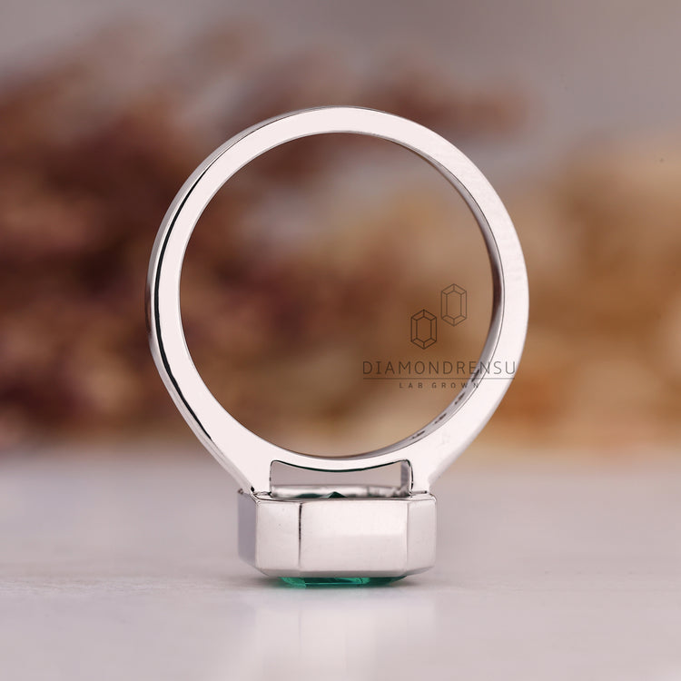 Handmade asscher cut emerald engagement ring.
