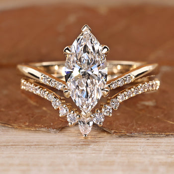 Marquise wedding ring with round cut pave style.