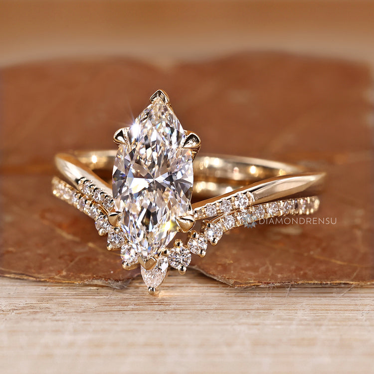 Upside down setting adds detail to the marquise wedding ring.