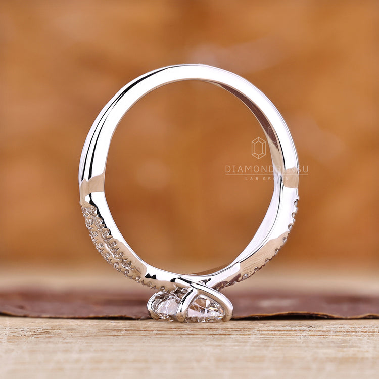IGI certified lab grown diamond ring with twisted pave details.
