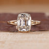 Bezel set diamond ring with cushion old mine cut diamond in solitaire setting.