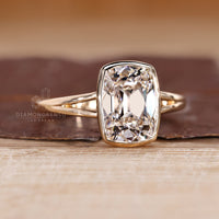 Handmade IGI certified bezel set diamond ring with solitaire style.