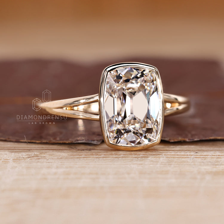 Handmade IGI certified bezel set diamond ring with solitaire style.