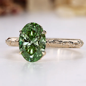 Art Deco engagement ring with a green oval center stone.