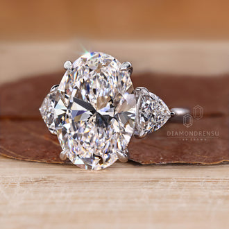 Oval diamond ring with four claw prong setting.
