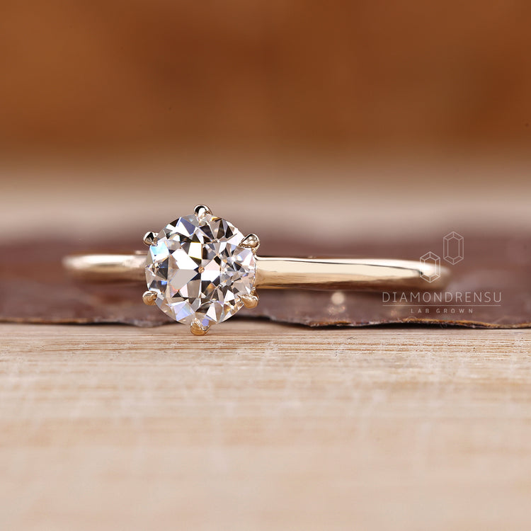 Handmade diamond ring in cathedral solitaire style.