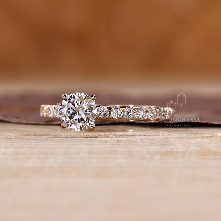 Custom pave setting engagement ring featuring lab grown diamond sparkle.
