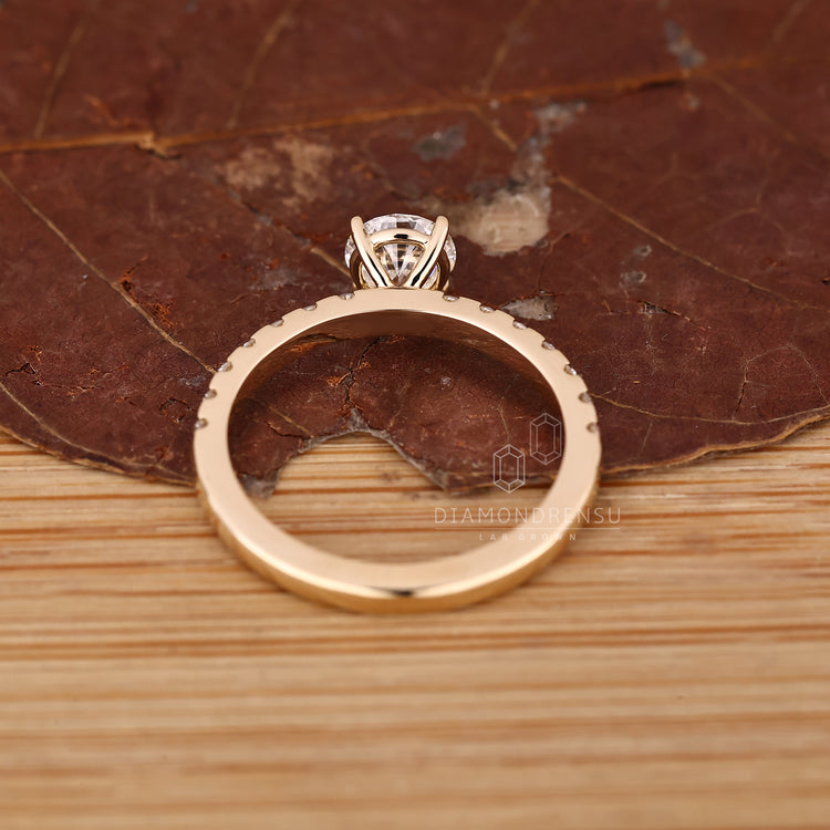 Custom round cut diamond ring with handmade craftsmanship.
