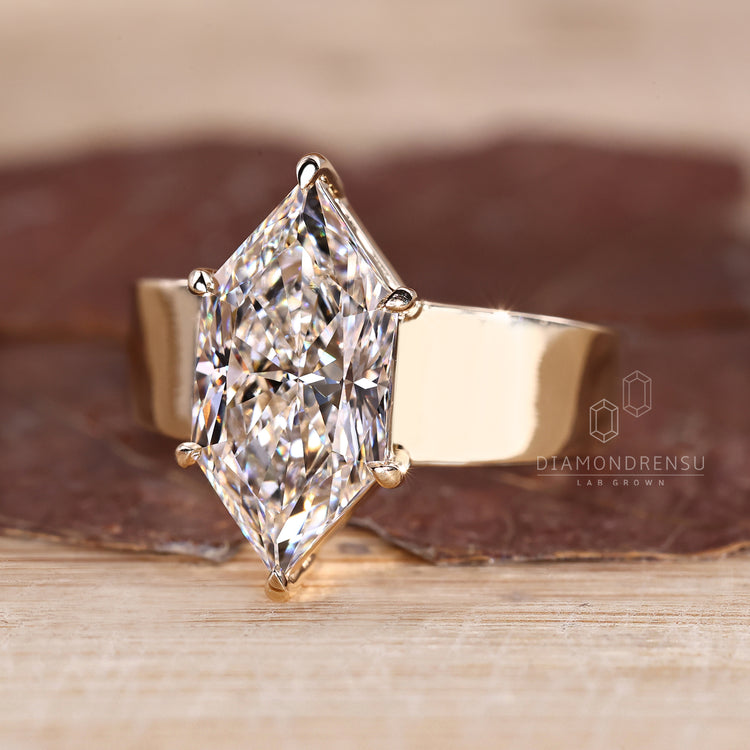 Basket setting ring with marquise center stone.
