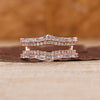 Double Band Wedding Ring with baguette and round cut diamonds in rose gold.
