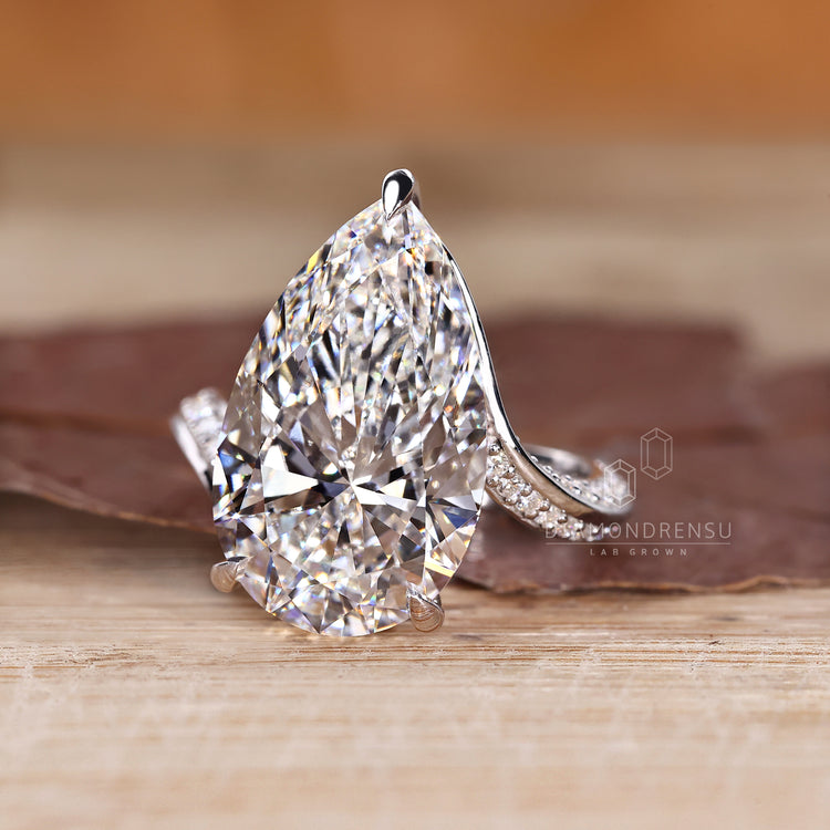 Pear diamond ring with bypass setting.
