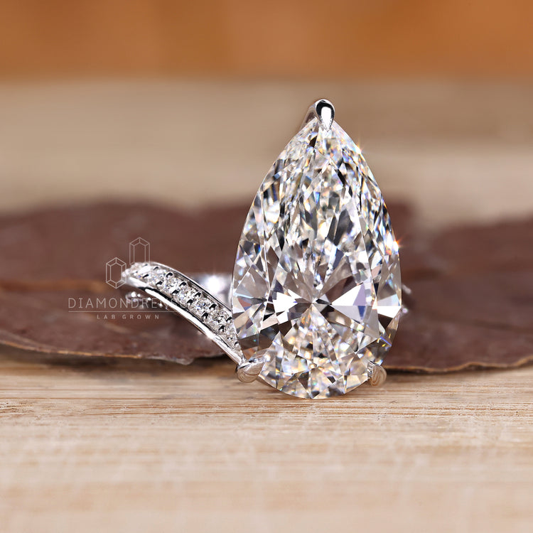 Custom diamond ring with pear cut stone.
