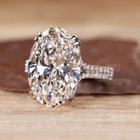 Trellis setting ring with oval lab grown diamond.
