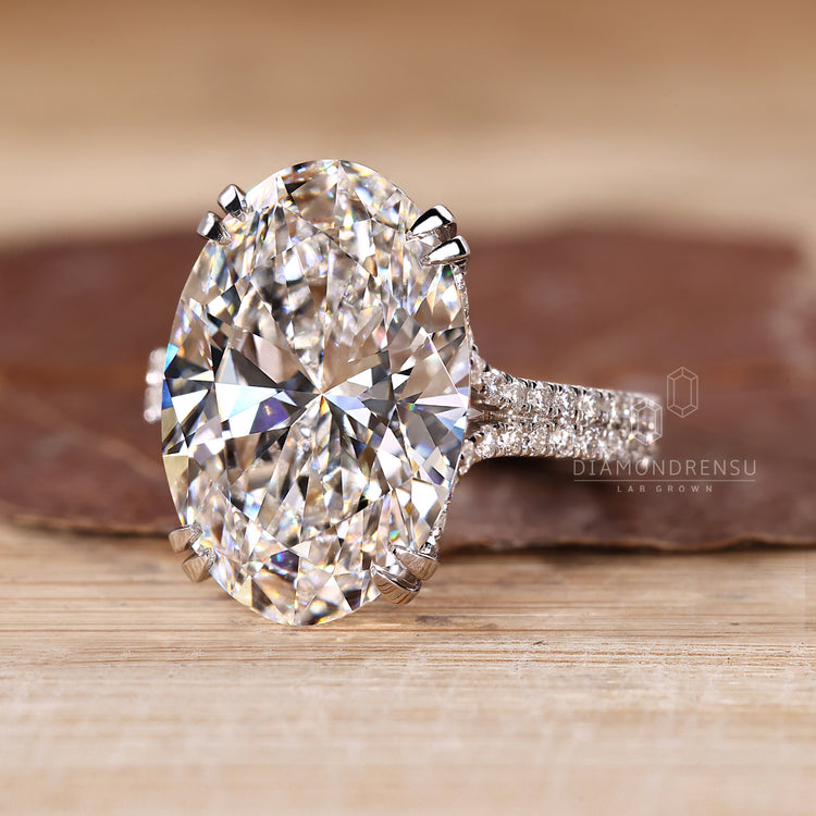 Trellis setting ring with oval lab grown diamond.
