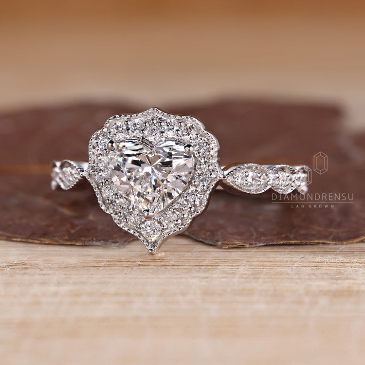 Heart Shaped Diamond Ring With Cathedral Setting And Three Prong Setting.