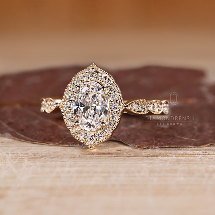 Handmade Oval Cut Diamond Ring With Round Pave Setting.