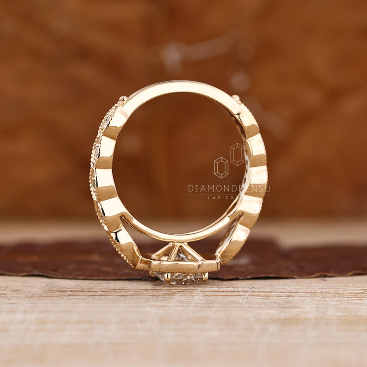 Elongated Cushion Ring With Round Cut Halo And Pave Accents.