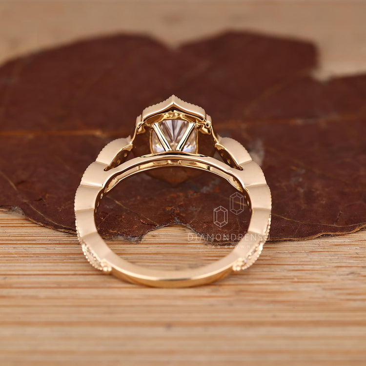 Elongated Cushion Cut Ring With Vintage Halo Design.