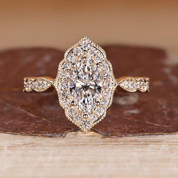 Vintage Marquise Diamond Ring Framed With Round Cut Halo.