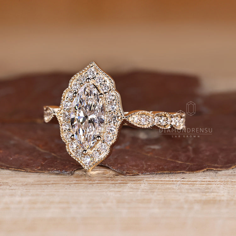 Marquise Diamond Ring With Cathedral Setting And Pave Band.